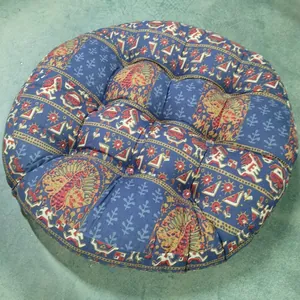 Close-up of Bohemian cotton linen round cushion with blue mandala and peacock patterns