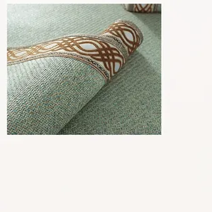 Close-up of high-density rattan mat weaving texture and geometric embroidered borders