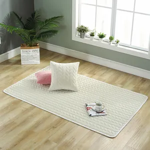 Minimalist beige plush floor rug with leaf-shaped quilting for a cozy living room decor