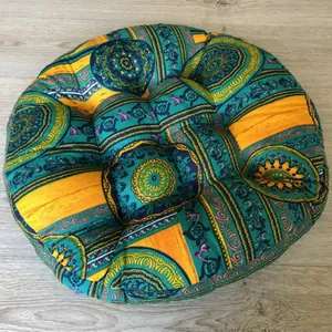 Detailed top view of a round Bohemian style floor cushion with vibrant mandala patterns