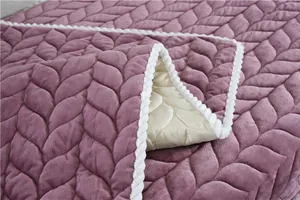 Detailed close-up of purple plush carpet with wheat pattern quilting and white rope piping