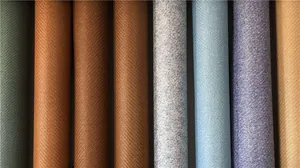 Detailed view of woven rattan texture rolls in various colors for European style bedding