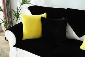 Close-up of thickened yellow and black rabbit plush sofa cushion with soft texture