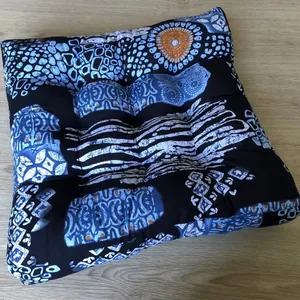 Close-up of square cotton linen cushion with ethnic indigo print and quilted texture