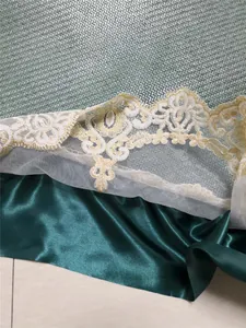Close-up of luxury hand-woven Indonesian rattan mat with detailed lace embroidery