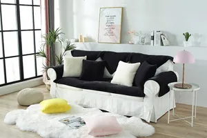 Detail of plush faux rabbit fur sofa cover with multi-color cushions in Nordic living room