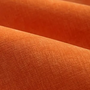 Texture macro del tessuto per divano in ciniglia arancione con trama fitta