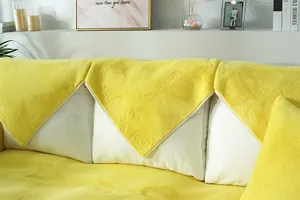 Close-up of thick lemon yellow faux rabbit fur sofa cover with plush texture and piping