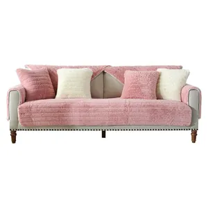 Pink plush quilted sofa cover set with fluffy throw pillows for winter comfort