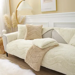 Close-up of thick plush sofa cover with wave quilted texture in warm cream and beige colors