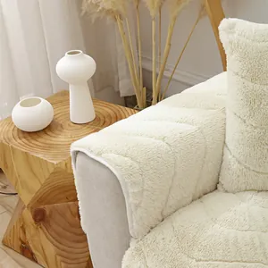 Close-up of plush cream sofa cushion with diamond quilting and faux fur texture
