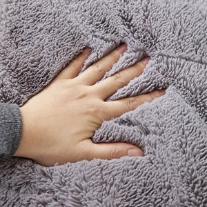 Detail showing high-density thick grey plush sofa cushion with soft texture and rebound