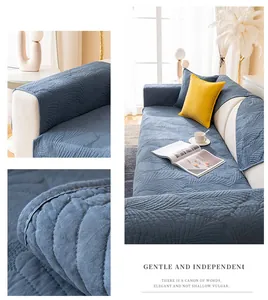 Détail de la housse de canapé matelassée gris-bleu avec coutures en plumes épaisses