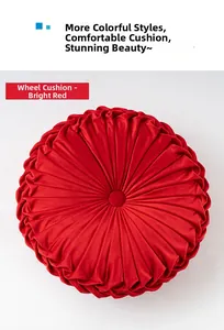 Detail of red round pumpkin-shaped pleated pillow with center button in velvet
