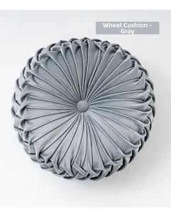 Detailed close-up of a grey round pleated velvet pumpkin cushion showing texture and button