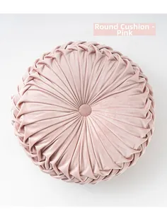 Close-up of pink pleated pumpkin round cushion with soft velvet fabric and center button