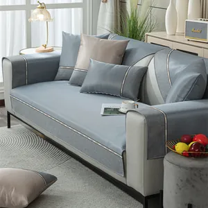 Close-up of gray-blue cooling ice silk sofa cover with decorative CHANGE lettering tape