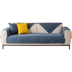Housse de canapé matelassée en coton bleu marine avec motifs de plumes en relief