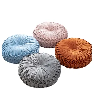 Plush pumpkin throw pillows in four colors with soft velvet texture and pleated design