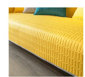 Detailed view of yellow cooling latex ice silk sofa mat with wavy quilted texture