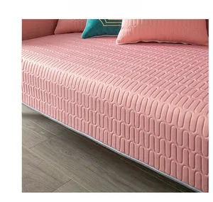 Detail of pink quilted cooling latex sofa mat with wave texture and smooth edge finish