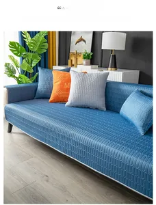 Detail of blue latex ice silk cooling sofa mat with wavy quilted texture and matching pillows