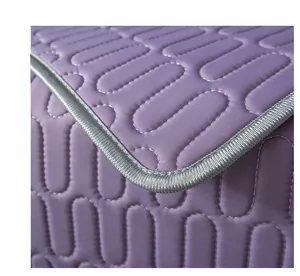 Detail of purple latex ice silk sofa mat with oval quilted texture and cooling fabric