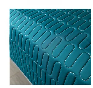 Close-up of teal ice silk fabric with wave quilting for a cooling summer sofa cover