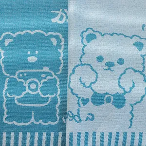 Detail of linen-cotton sofa cover showing cute bear jacquard texture and stripe patterns