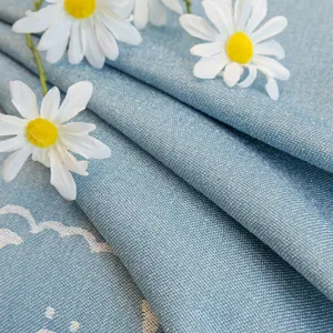 Linen texture sky blue sofa cover with white cloud patterns and daisy accents