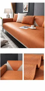 Detail of orange anti-scratch sofa cover with white stitching and leather-like texture