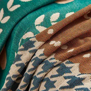Close-up of thick jacquard woven fabric with leaf pattern and houndstooth texture