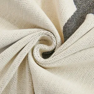 Macro detail of thickened chenille sofa cover showing grey abstract patterns and soft texture