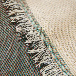 Double-sided woven cotton sofa cover with colorful stripes and natural fringe edges
