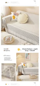 Detail of light gray Nordic sofa cover with vertical grid texture and elegant fringe