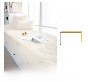 Detail of plush cream-white bay window mat with thick faux fur and wavy quilted pattern