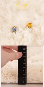 Macro detail of 4cm thick plush fabric showing soft long pile texture for window mats