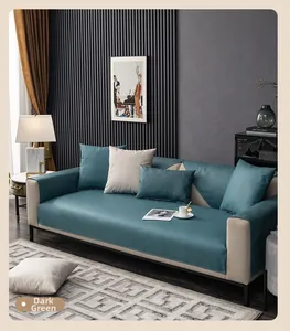 Detail of dark green waterproof sofa cover with quilted diamond texture and matching pillows