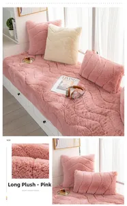 Detail of pink plush bay window mat showing quilted wave patterns and thick texture