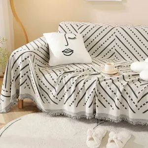 Nordic minimalist cat-scratch resistant sofa cover with geometric patterns and fringe