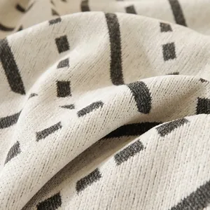 Modern cream sofa cover with black geometric stripes in durable scratch-resistant fabric