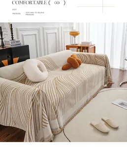 Close-up of chenille sofa cover with abstract brown lines and elegant fringed edges