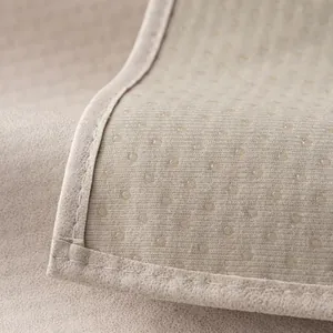 Beige waterproof sofa cover with anti-slip silicone dots and reinforced stitched edges