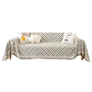 Nordic minimalist cat-scratch-proof sofa cover with geometric patterns and fringe detail