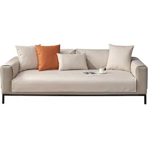 Waterproof tech fabric sofa cover set with cream cushions and orange accent pillow
