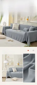 Detail of light grey waffle weave sofa cover featuring elegant white wavy lace edges
