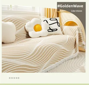 Detail of liquid gold wave pattern sofa cover with soft fringes and woven texture