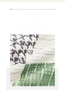 Macro detail of breathable waffle weave texture on a green striped sofa cover cloth