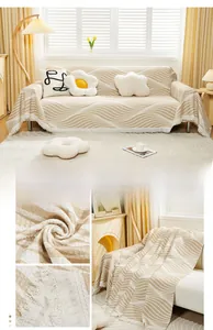Close-up of cream wavy textured sofa throw with cotton waffle fabric and white tassels