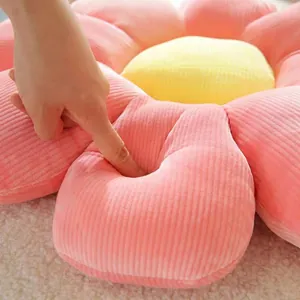 Plush sunflower seat cushion in pink and yellow with thick soft striped velvet texture